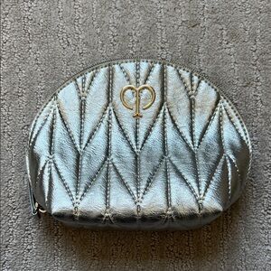 cle de peau Metallic Silver Quilted Cosmetic Case with Gold Emblem
